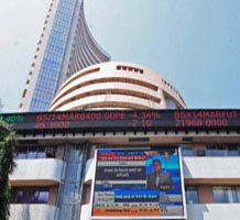 Nifty hovers around 7,500; defensives gain